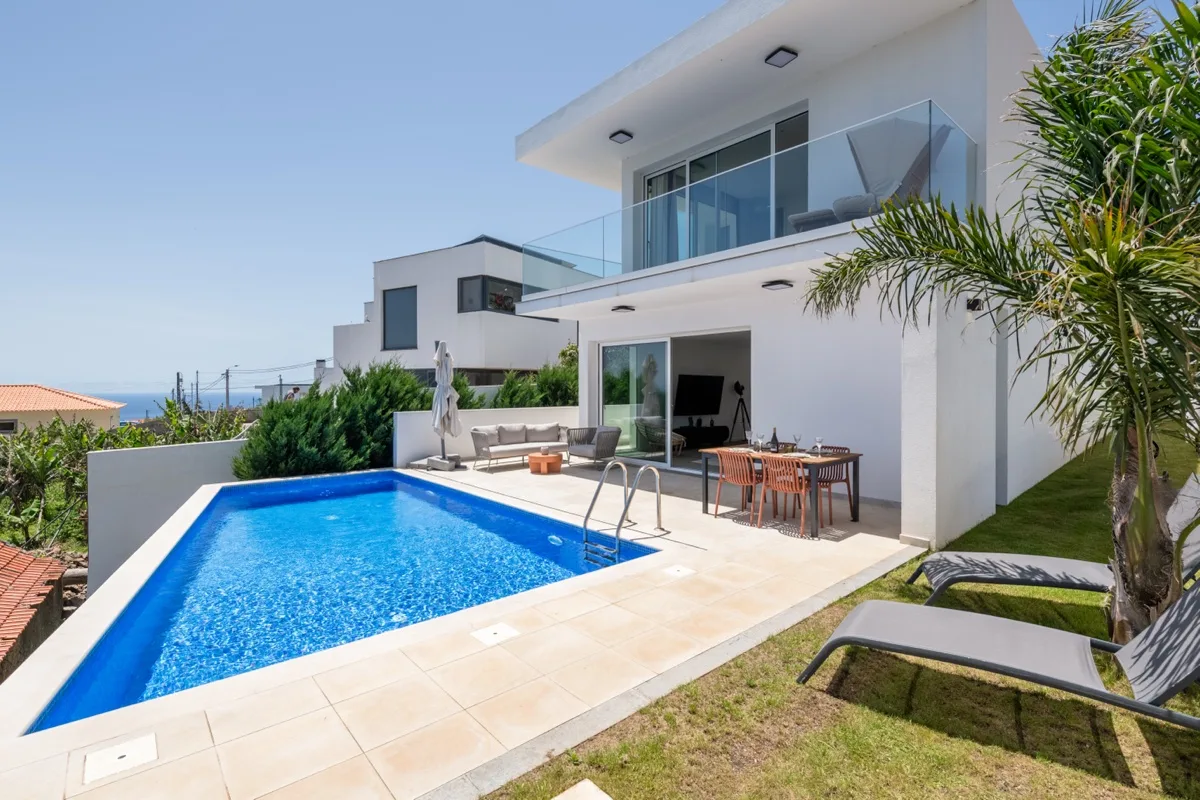 The heated pool running along the terrace at Villa Calma