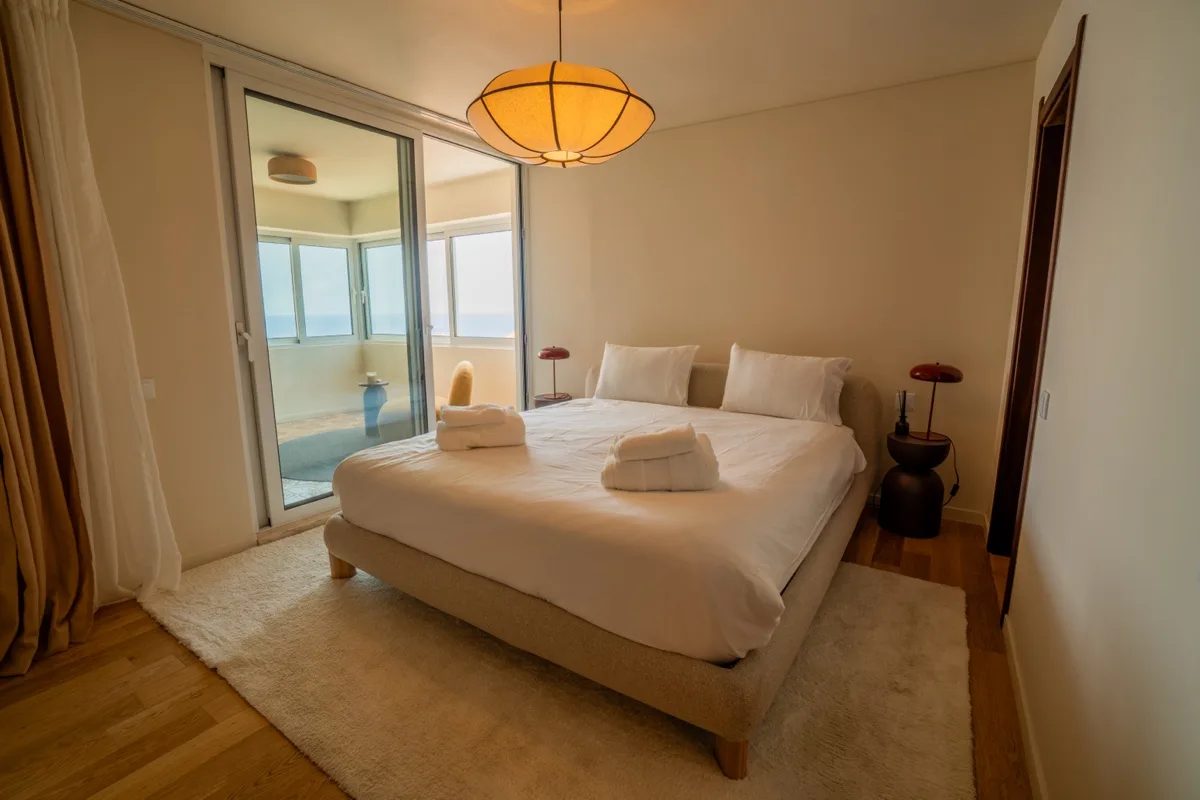 The main bedroom opening onto the ocean-facing balcony