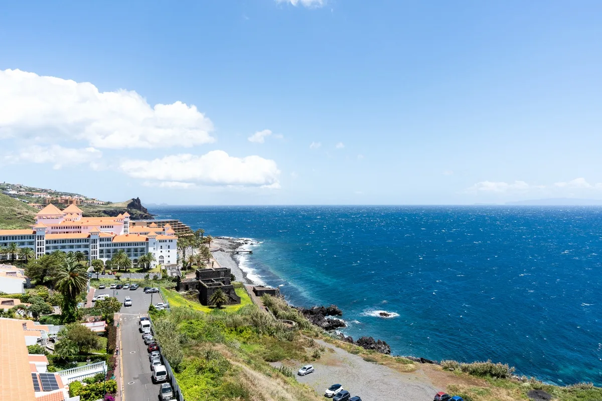 The Caniço coastline meeting the Atlantic